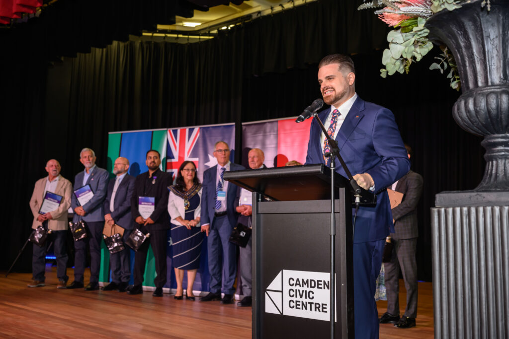 Nathan Cassar, corporate event mc speaking at Camden Civic Centre awards ceremony