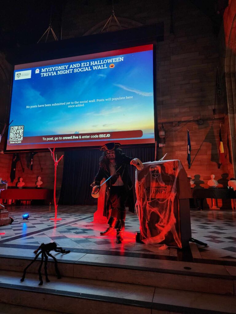 Pirate host on stage at Halloween trivia night