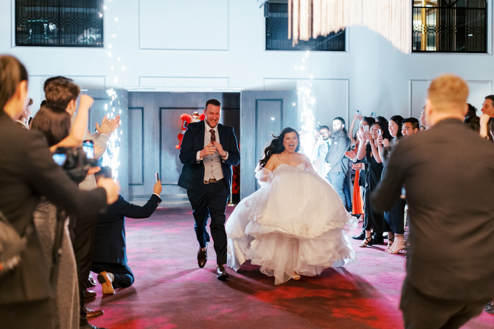 Bride and groom enter reception with sparklers