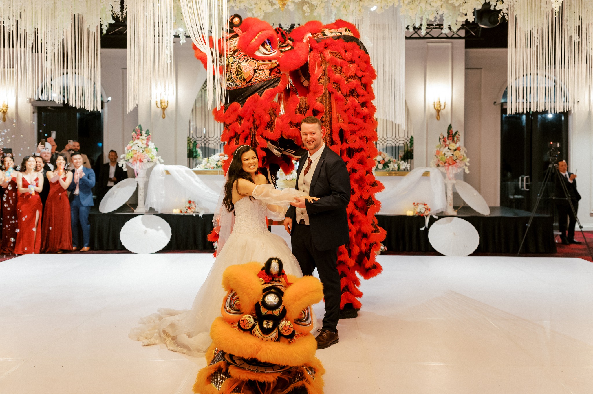Bride and groom with lion dance at reception